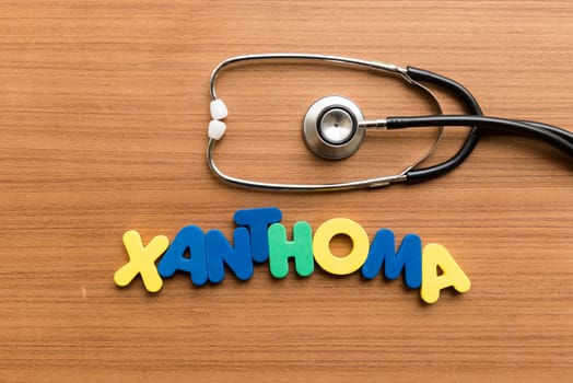 xanthoma colorful word with stethoscope on wooden background