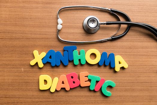 xanthoma diabetic colorful word with stethoscope on wooden background