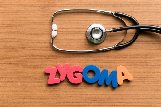zygoma colorful word with stethoscope on wooden background