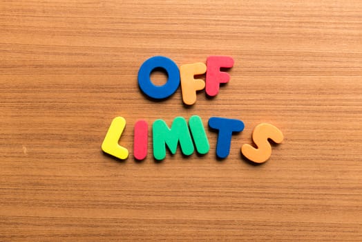 off limits colorful word on the wooden background