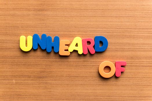 unheard of colorful word on the wooden background