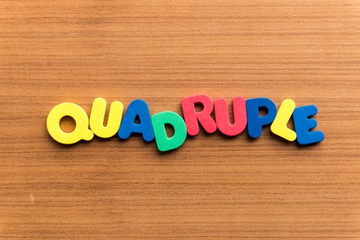 quadruple colorful word on the wooden background