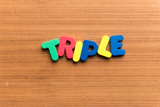 triple colorful word on the wooden background
