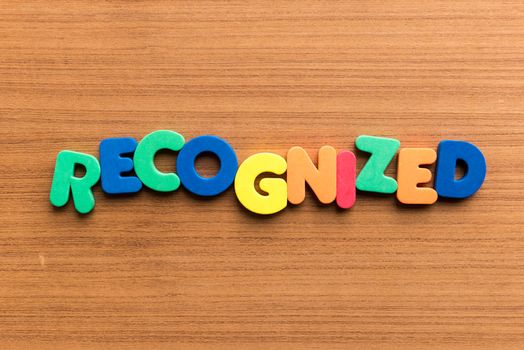 recognized colorful word on the wooden background