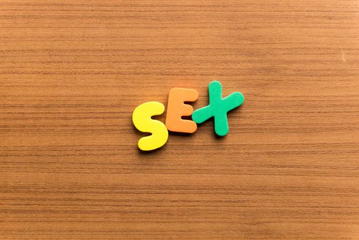 Sex colorful word on the wooden background