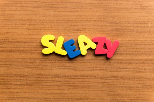 sleazy colorful word on the wooden background