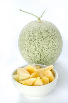 freshly cut cantaloupe melon on white background