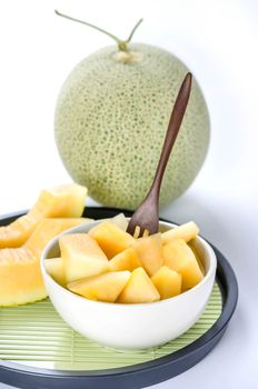 freshly cut cantaloupe melon on white background