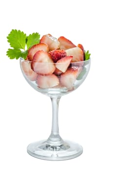 Fresh slices of strawberry in glass on a white background isolated