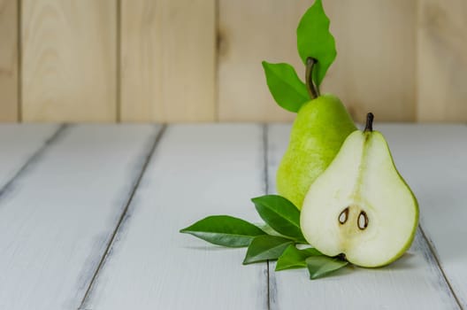 Fresh pears on the wooden background , Free space for text