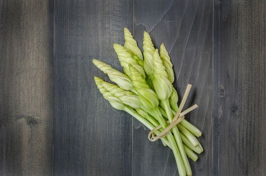 top view of Moonflower (Ipomoea alba L.) on wooden background,  Free space for text