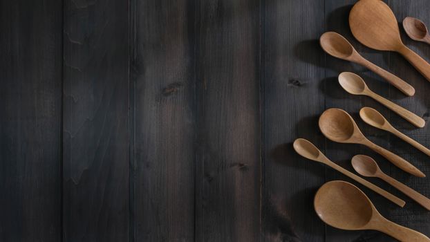 different wooden spoon on the table with copy space for text
