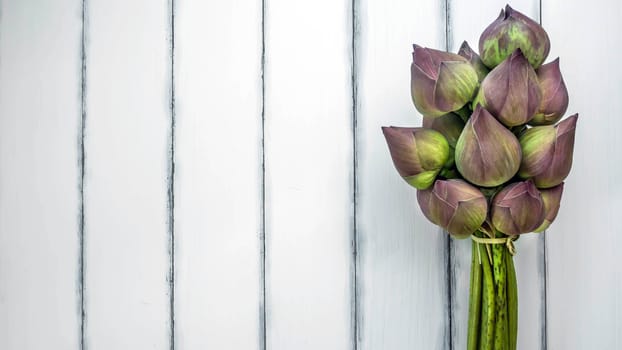 top view of pink water lily over wooden background,  Free space for text