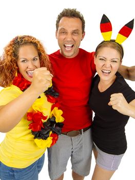 Photo of three people cheering for Germany, wearing shirts with the colours of the German flag.