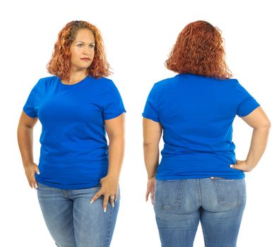 Photo of a woman posing with a blank blue t-shirt, ready for your artwork or design.