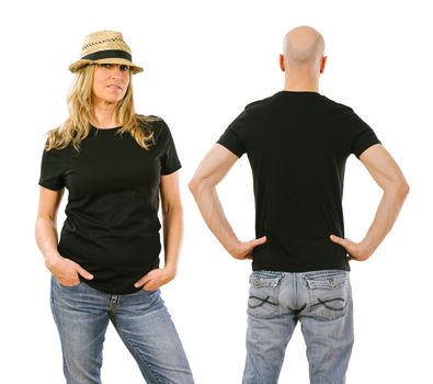 Photo of a woman and a man posing with a blank black t-shirt, ready for your artwork or design.
