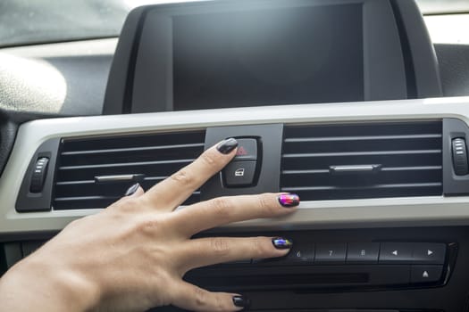 close-up of a girl's hand on the dashboard in a car