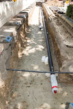 Laying new pipes in trench