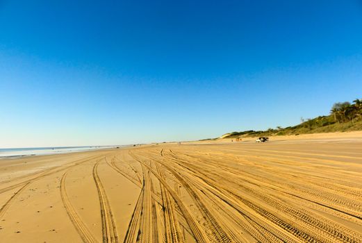 Tyre tracks in the sand on Cable Beach, Broome