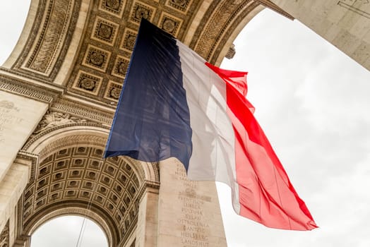 Arc de Triomphe with french flag hanging below