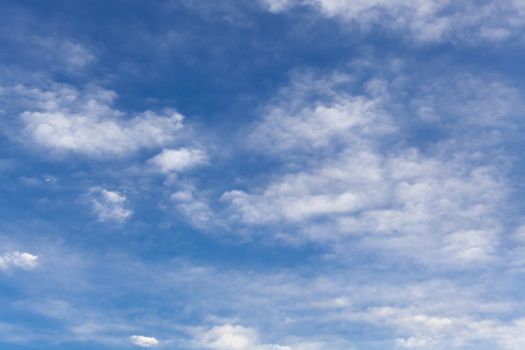 The beautiful blue sky with white clouds in the light of a rising sun