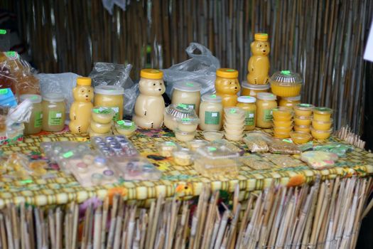 Sale of honey. Vintage counter on a wooden table