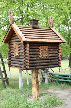 Toy house in the woods . A hut on chicken legs.