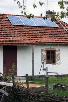 Old antique house with solar panels on the roof