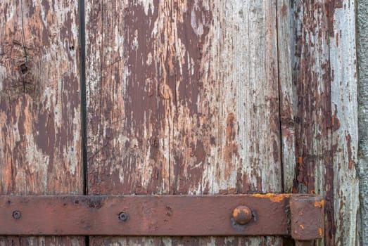 texture of wooden surface with remnants of old paint that has dried and cracked under the influence of weather