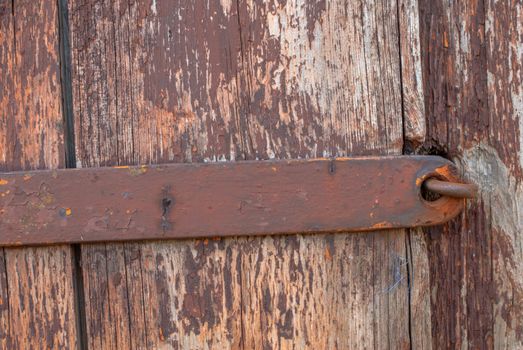 texture of wooden surface with remnants of old paint that has dried and cracked under the influence of weather