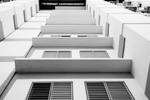 Look up at apartment housing in Thailand. Step of building.