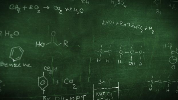 Organic chemical formulas on a green chalkboard