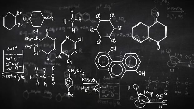 Chemical formulas written on chalkboard background