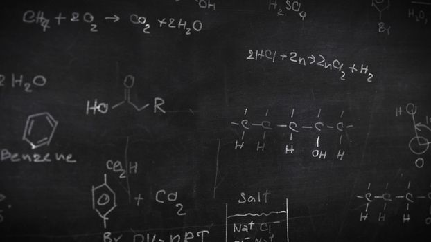 Chemical formulas on black background. Depth of fields