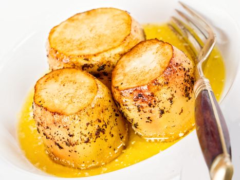 close up of golden fondant potato