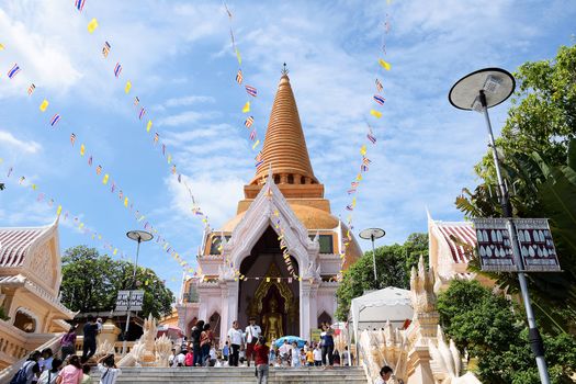 NAKHON PATHOM - JULY 19: PRA PA-THOM CHEDI is famous architecture temple in Thailand. The Buddhist Lent Day has many people in Pagoda Religious place.