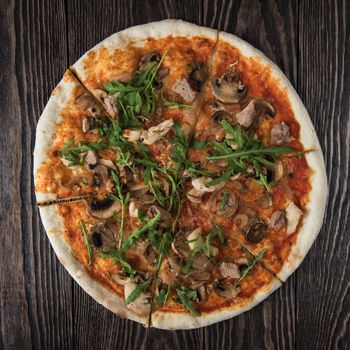 Pizza with chicken mushrooms and rukkola