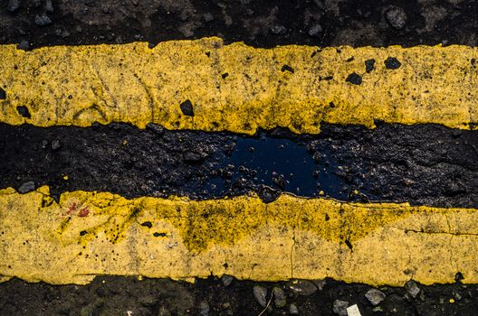 Grungy Double Yellow Line Road Markings On A British Street