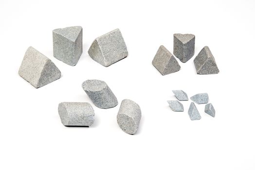 Sharpening stones sets in different shapes on white background