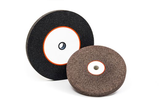 Industrial grinding and polishing wheels on white background