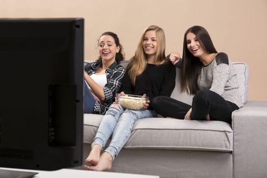 Girls watching movies with popcorn