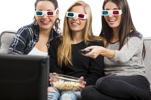 Girls watching 3D movies with popcorn