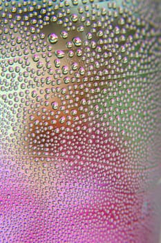 Abstract background. Drops of water on the crooked glass, shallow dof