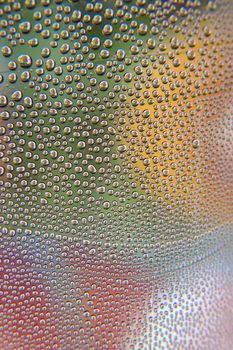 Abstract background. Drops of water on the crooked glass, shallow dof