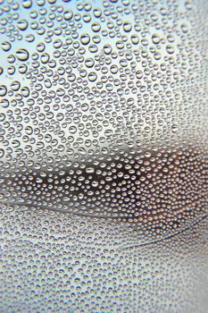 Drops of water on the crooked glass, shallow dof 