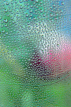 Abstract background. Drops of water on the crooked glass, shallow dof