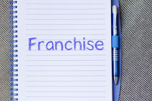 Franchise text concept write on notebook with pen