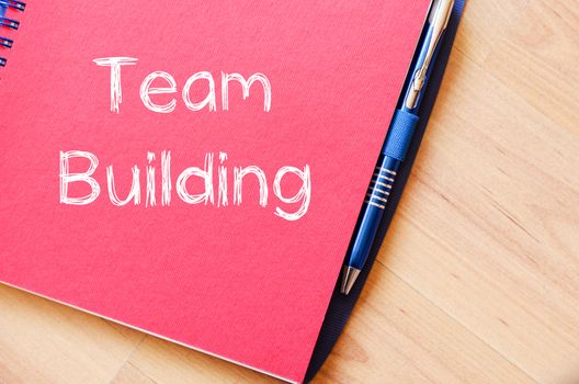 Team building text concept write on notebook with pen