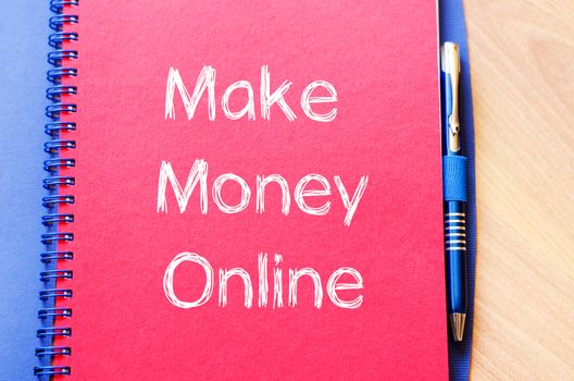 Make money online text concept write on notebook with pen