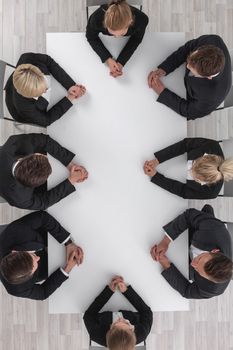 Diverse business people sitting around the table on a meeting